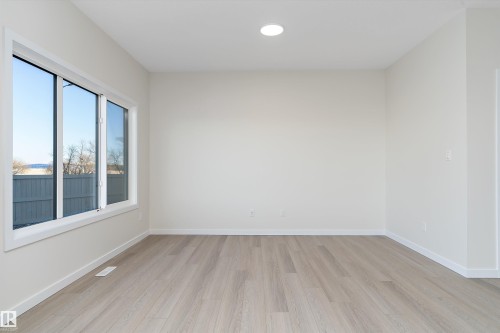 Unfurnished room featuring light wood-style flooring and recessed lighting - 823 Rowan Close, Edmonton, AB - Indoor Photo Showing Other Room