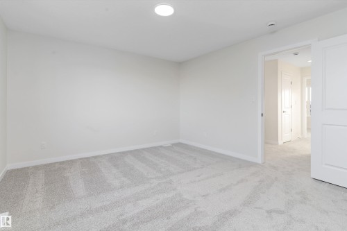 Unfurnished room featuring light colored carpet and baseboards - 823 Rowan Close, Edmonton, AB - Indoor Photo Showing Other Room