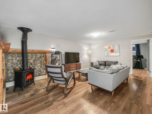 10540 55 Avenue, Edmonton, AB - Indoor Photo Showing Living Room With Fireplace