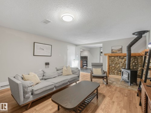 10540 55 Avenue, Edmonton, AB - Indoor Photo Showing Living Room With Fireplace