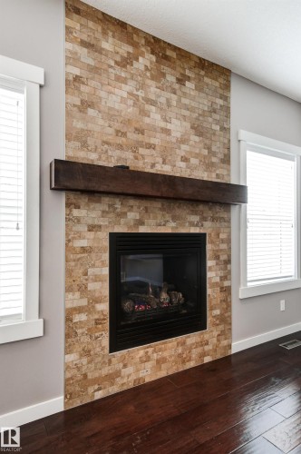 3952 Claxton Loop, Edmonton, AB - Indoor Photo Showing Living Room With Fireplace