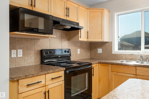 243 Southwick Way, Leduc, AB - Indoor Photo Showing Kitchen With Double Sink