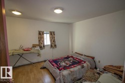Bedroom with wood finished floors - 