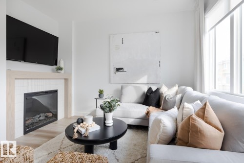 3245 Dixon Way, Edmonton, AB - Indoor Photo Showing Living Room With Fireplace