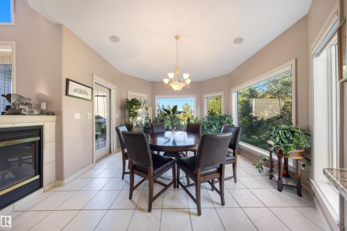 201 Erin Ridge Drive, St. Albert, AB - Indoor Photo Showing Dining Room With Fireplace