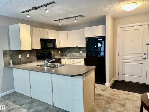 336 400 Palisades Way, Sherwood Park, AB - Indoor Photo Showing Kitchen With Double Sink