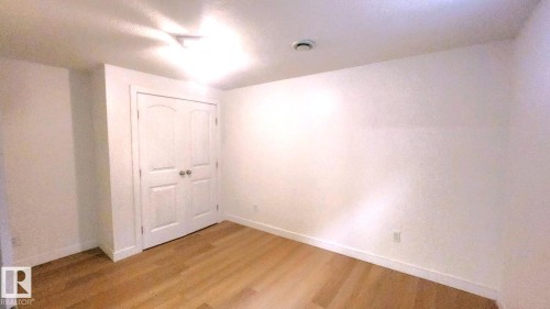 Spare room featuring light wood-style flooring and baseboards - 11516 133A Avenue, Edmonton, AB - Indoor Photo Showing Other Room