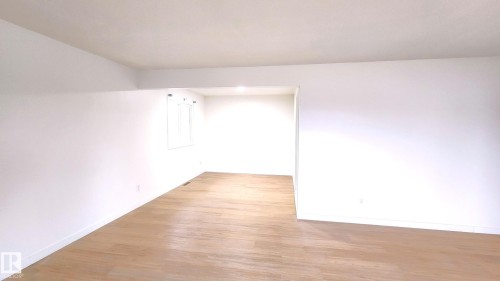 Empty room featuring wood finished floors and baseboards - 11516 133A Avenue, Edmonton, AB - Indoor Photo Showing Other Room