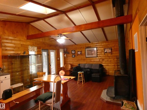 View to front door from the side door entry at the kitchen end. - 13 Willow Place, Rural Barrhead County, AB 