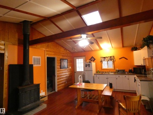 Looking toward front door from the side entryway. - 13 Willow Place, Rural Barrhead County, AB 