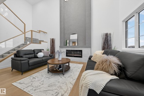 212 Crystal Creek Drive, Leduc, AB - Indoor Photo Showing Living Room With Fireplace