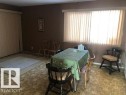Dining space featuring tile patterned floors - 4213 42 Avenue, Innisfail, AB  - Indoor 