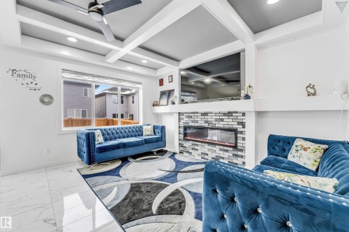 1216 15 Street, Edmonton, AB - Indoor Photo Showing Living Room With Fireplace