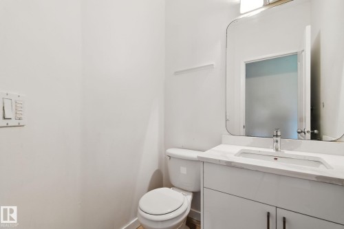 Bathroom featuring vanity and toilet - 7836 7 Avenue, Edmonton, AB - Indoor Photo Showing Bathroom
