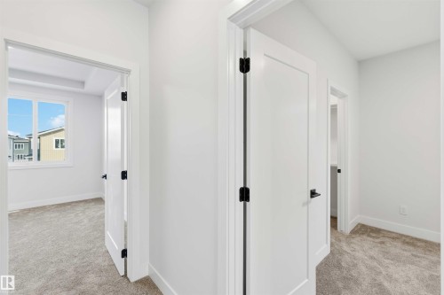 Corridor with light carpet - 94 Eldridge Pointe, St. Albert, AB - Indoor Photo Showing Other Room