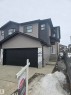 View of front of house with a garage and concrete driveway - 7706 174A Avenue, Edmonton, AB  - Outdoor 