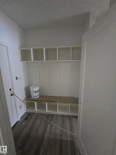Mudroom featuring dark wood finished floors - 7706 174A Avenue, Edmonton, AB - Indoor