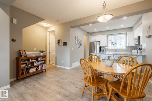 Dining space featuring light wood-type flooring - 5 2072 Wonnacott Way, Edmonton, AB - Indoor Photo Showing Dining Room