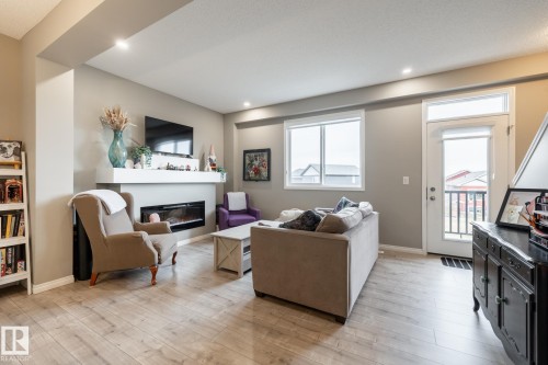5 2072 Wonnacott Way, Edmonton, AB - Indoor Photo Showing Living Room With Fireplace