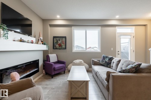 5 2072 Wonnacott Way, Edmonton, AB - Indoor Photo Showing Living Room With Fireplace
