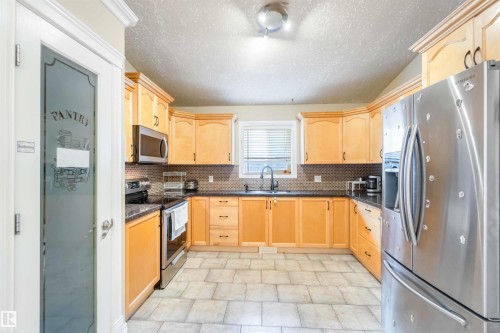 Edmonton, AB - Indoor Photo Showing Kitchen With Double Sink