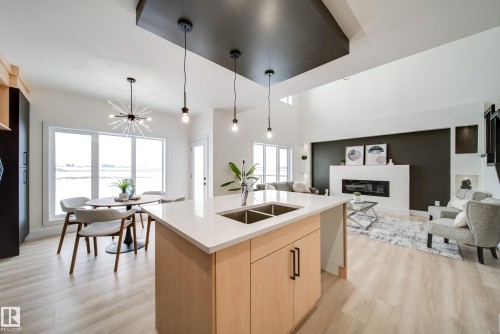 7156 177 Avenue, Edmonton, AB - Indoor Photo Showing Kitchen With Fireplace With Double Sink
