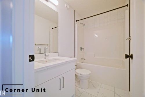 Full bathroom with vanity, shower / bathtub combination, and light marble finish floors - 7585 174A Avenue, Edmonton, AB - Indoor Photo Showing Bathroom
