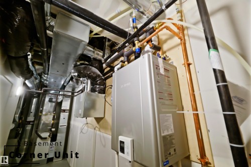 Utilities featuring tankless water heater - 7585 174A Avenue, Edmonton, AB - Indoor Photo Showing Basement