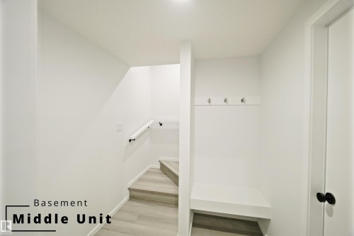 Mudroom featuring light wood-style flooring and baseboards - 7585 174A Avenue, Edmonton, AB - Indoor Photo Showing Other Room