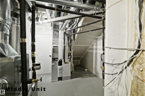 Utility room featuring heating unit - 7585 174A Avenue, Edmonton, AB - Indoor Photo Showing Basement