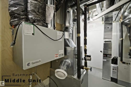 Utility room with heating unit - 7585 174A Avenue, Edmonton, AB - Indoor Photo Showing Basement