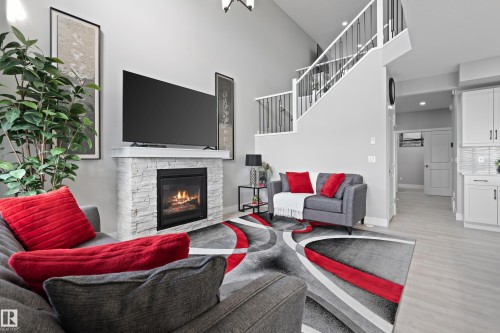 2654 Donaghey Crescent, Edmonton, AB - Indoor Photo Showing Living Room With Fireplace