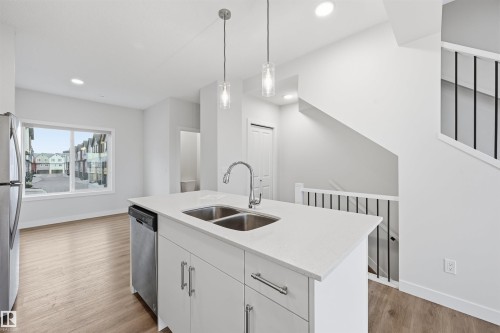 38 1010 Rabbit Hill Road, Edmonton, AB - Indoor Photo Showing Kitchen With Double Sink