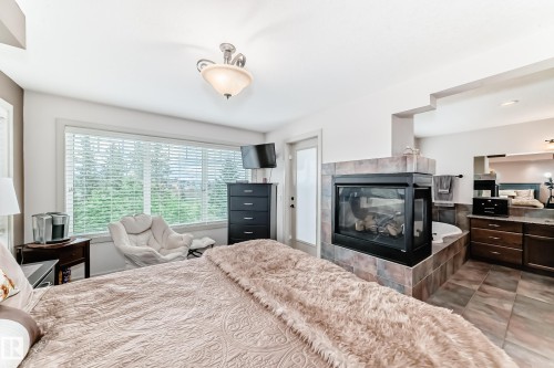 1673 James Mowatt Trail, Edmonton, AB - Indoor Photo Showing Bedroom With Fireplace