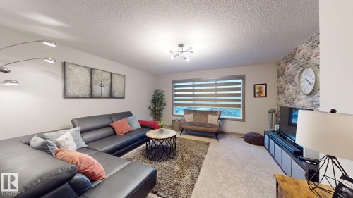 8031 Evans Crescent, Edmonton, AB - Indoor Photo Showing Living Room