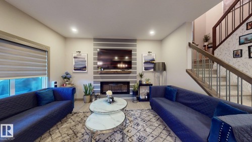 8031 Evans Crescent, Edmonton, AB - Indoor Photo Showing Living Room With Fireplace