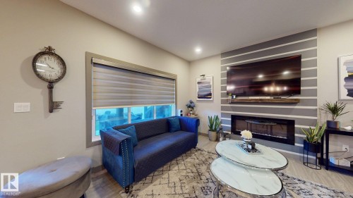 8031 Evans Crescent, Edmonton, AB - Indoor Photo Showing Living Room With Fireplace