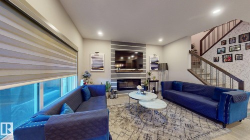 8031 Evans Crescent, Edmonton, AB - Indoor Photo Showing Living Room With Fireplace
