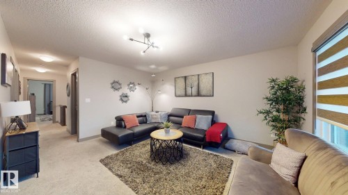 8031 Evans Crescent, Edmonton, AB - Indoor Photo Showing Living Room