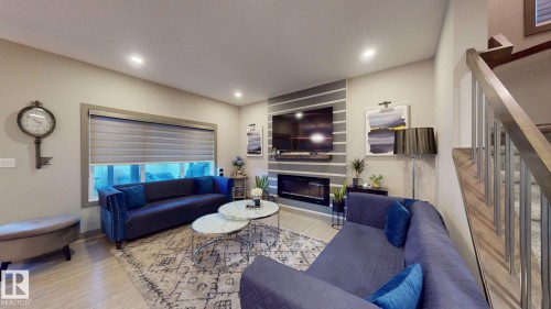 8031 Evans Crescent, Edmonton, AB - Indoor Photo Showing Living Room With Fireplace