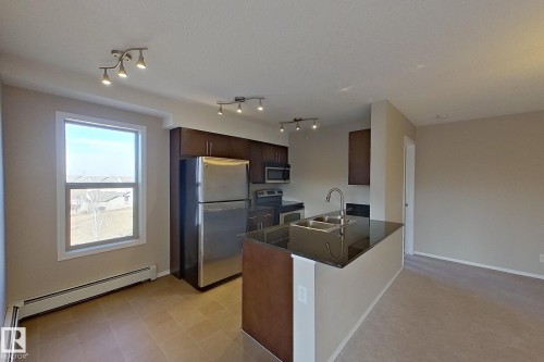 414 11820 22 Avenue, Edmonton, AB - Indoor Photo Showing Kitchen With Double Sink