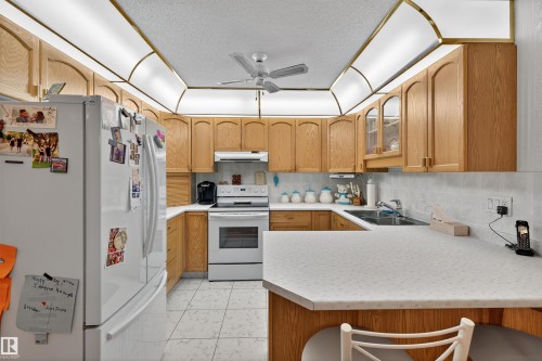 103 10935 21 Avenue, Edmonton, AB - Indoor Photo Showing Kitchen With Double Sink