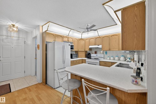 103 10935 21 Avenue, Edmonton, AB - Indoor Photo Showing Kitchen With Double Sink