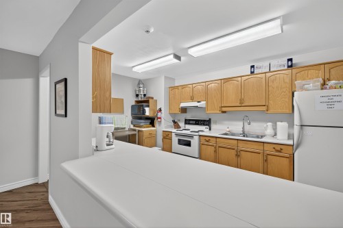 103 10935 21 Avenue, Edmonton, AB - Indoor Photo Showing Kitchen With Double Sink
