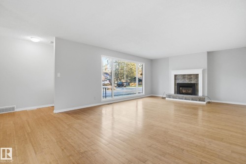 4902 63 Street, Rural Lac Ste. Anne County, AB - Indoor Photo Showing Living Room With Fireplace