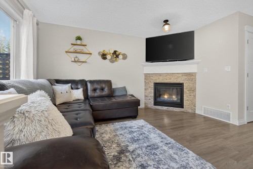 64 Hamilton Court, Spruce Grove, AB - Indoor Photo Showing Living Room With Fireplace