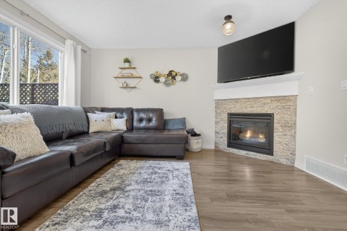 64 Hamilton Court, Spruce Grove, AB - Indoor Photo Showing Living Room With Fireplace