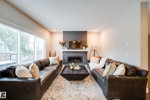 4373 Crabapple Crescent, Edmonton, AB - Indoor Photo Showing Living Room With Fireplace