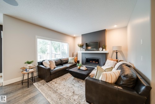 4373 Crabapple Crescent, Edmonton, AB - Indoor Photo Showing Living Room With Fireplace