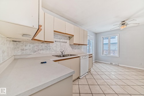 7539 76 Avenue, Edmonton, AB - Indoor Photo Showing Kitchen With Double Sink